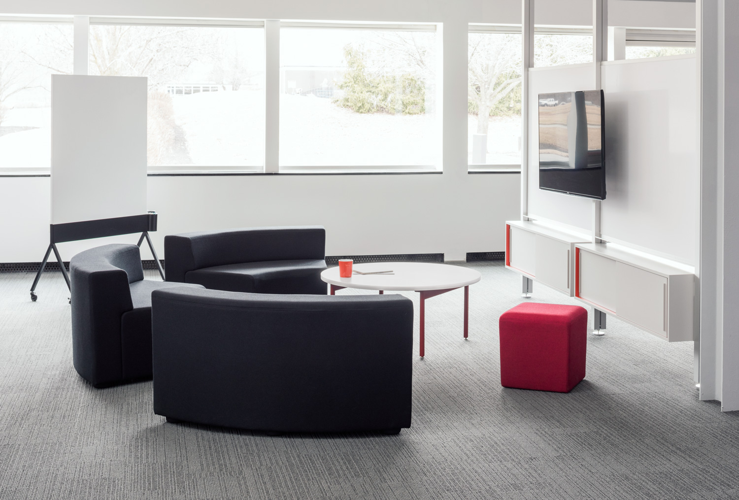 Knoll white Antenna low table with red legs, grey k. lounge and Interpole for Activity Spaces and other meeting spaces